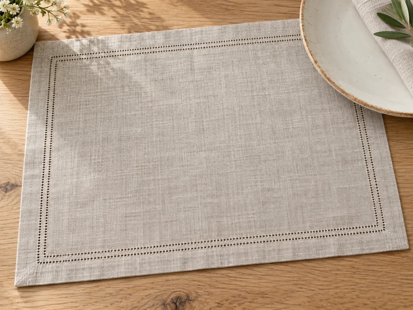 Flax-coloured placemat with a double hemstitched border