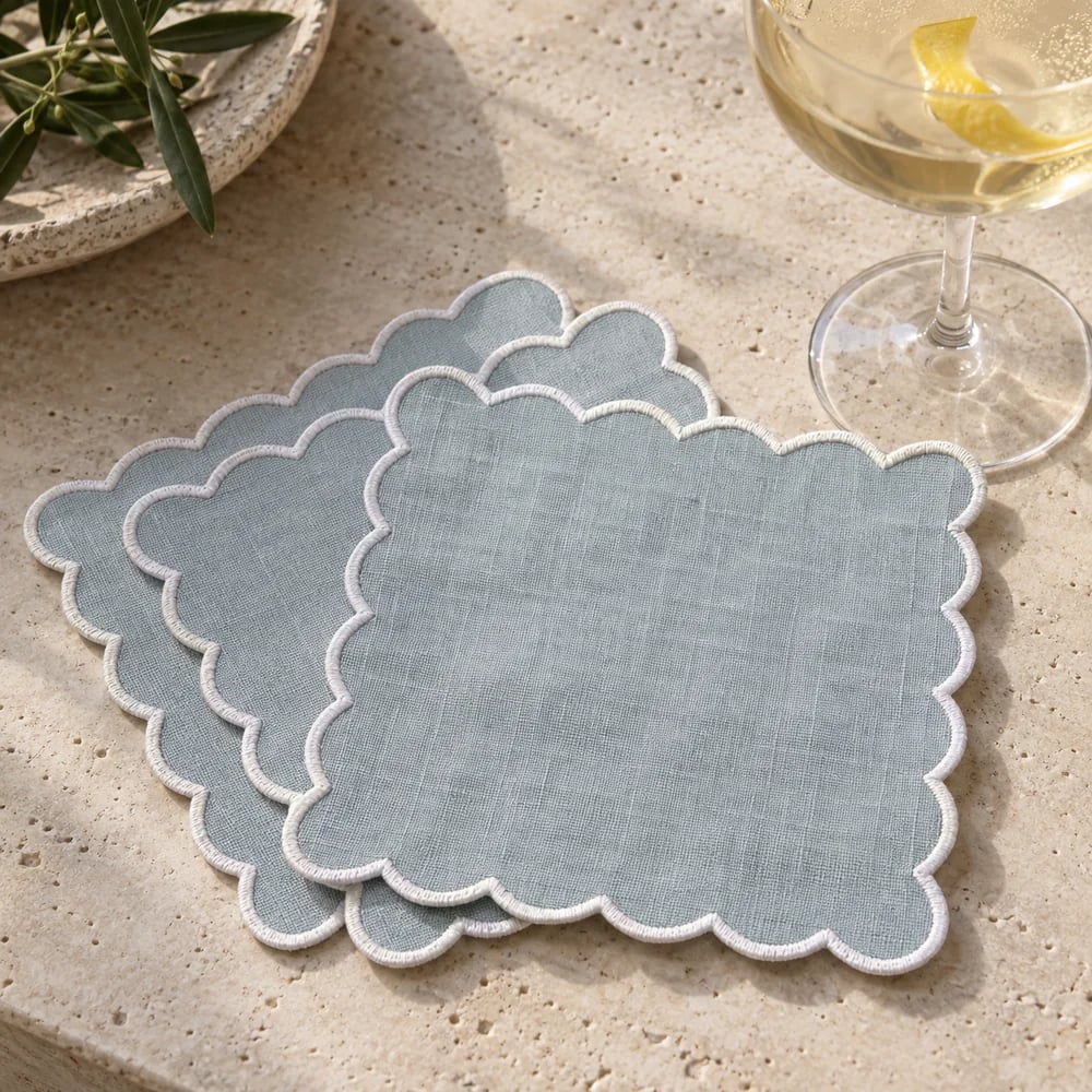 Muted blue cocktail napkin, scalloped edge