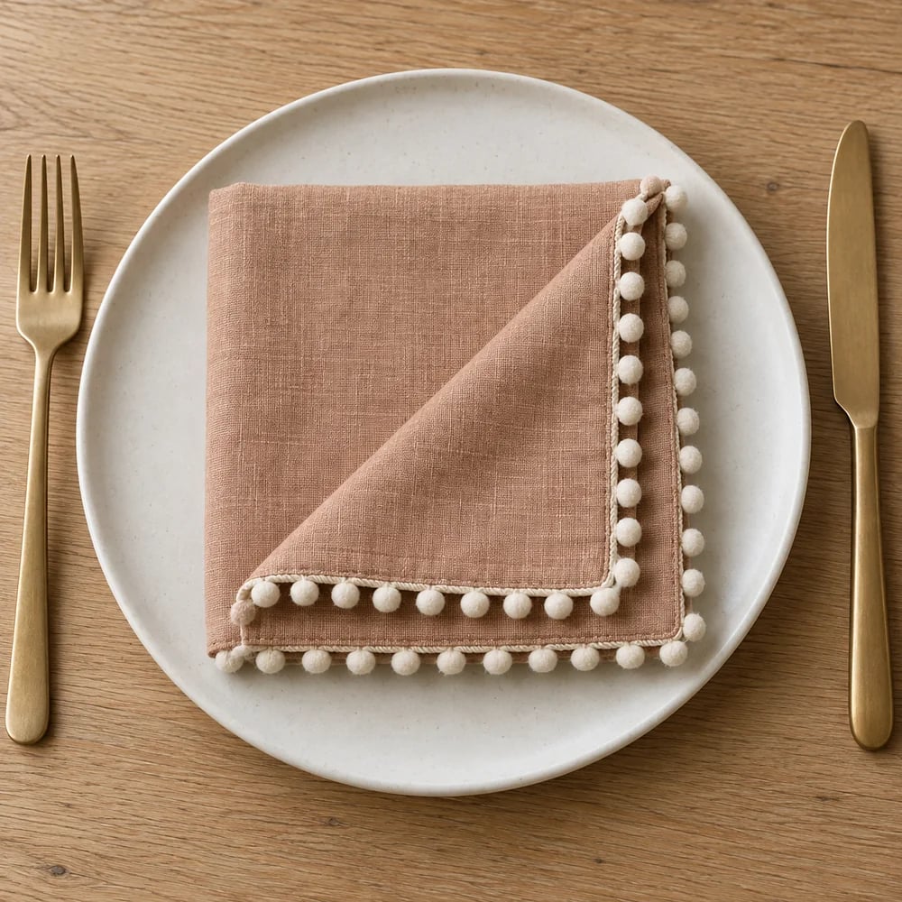 Clay dinner napkin, pom pom trim