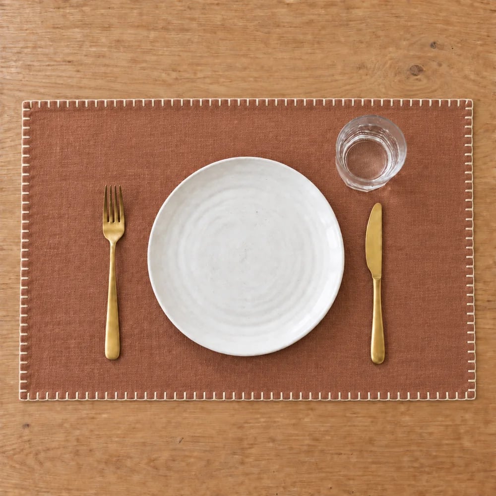 Terracotta placemat, blanket stitch edge