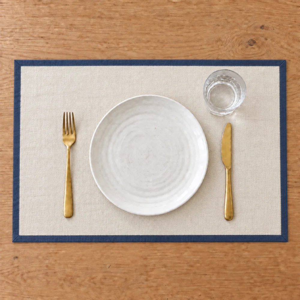 Ivory placemat, contrast bound edge