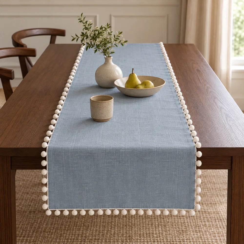 Muted blue table runner, pom pom trim